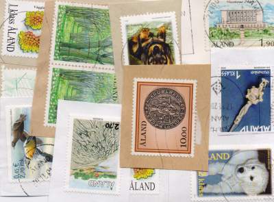 Aland postage stamps on paper